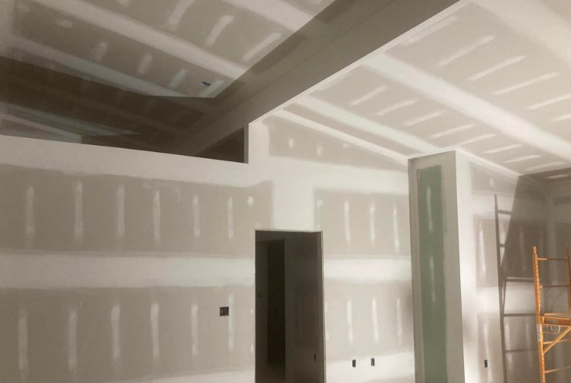 Drywall taping and mudding in a large residential space